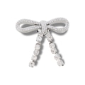 Jibbitz™ Crocs Laço de Pedras BRANCO