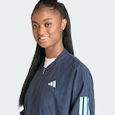 Jaqueta Corta-vento de Malha adidas Essentials Três Listras Feminina - Foto 6