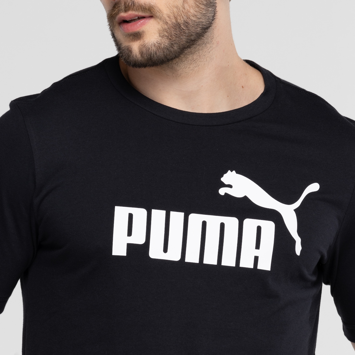 Camiseta Masculina Puma Manga Curta ESS Tee Logo - Foto 6