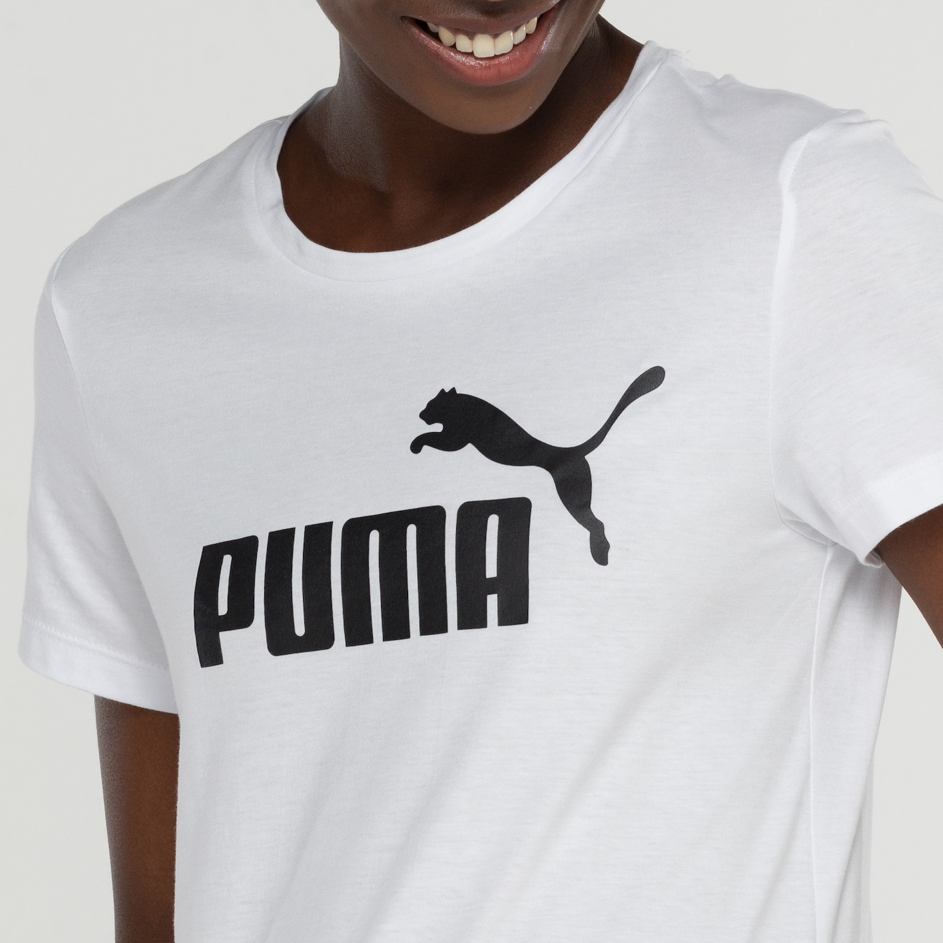 Camiseta Feminina Puma Manga Curta ESS Tee Logo - Foto 6