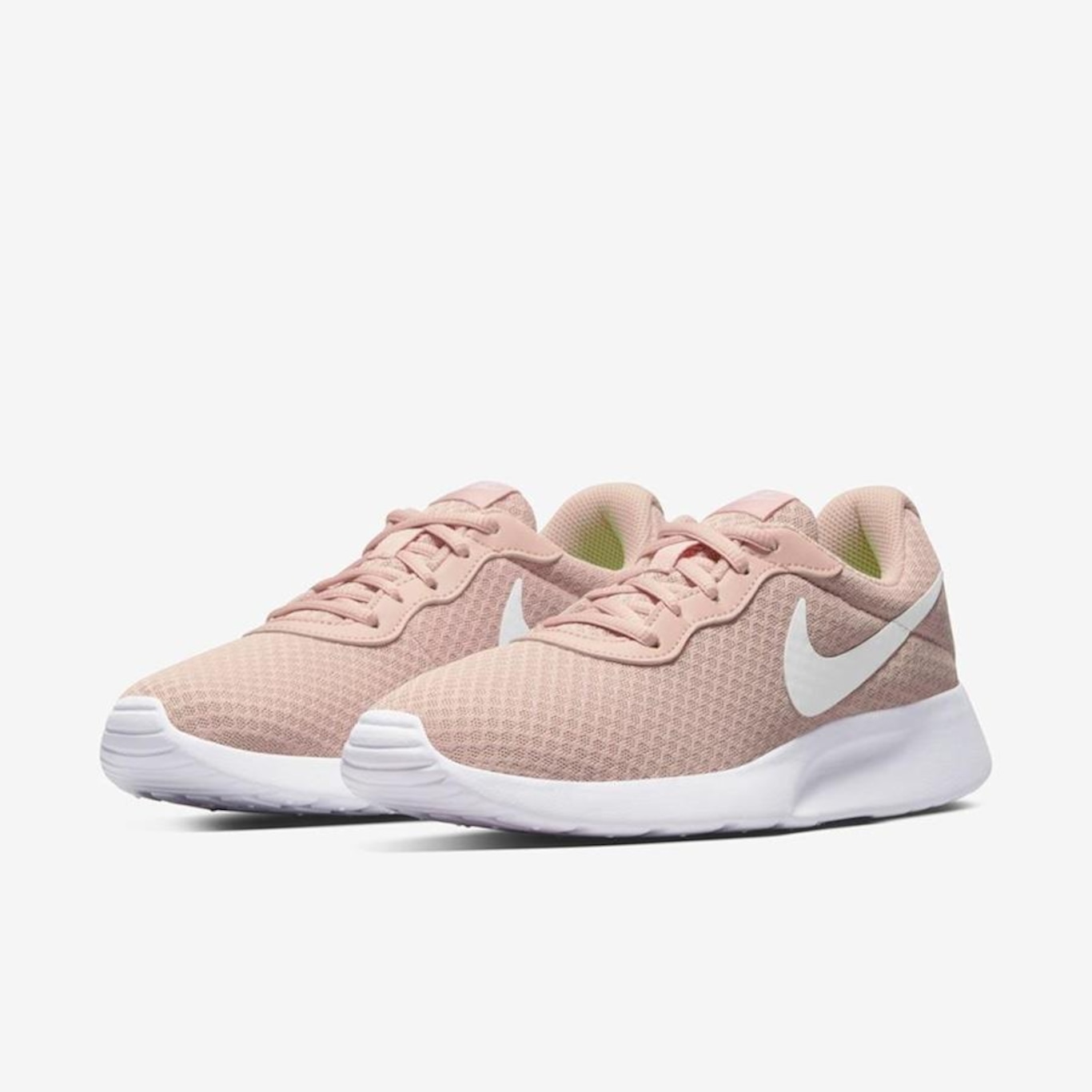 Pink nike tanjun store shoes