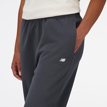 Calça New Balance Athletics - Feminina